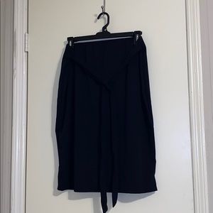 Black pencil skirt with tie.